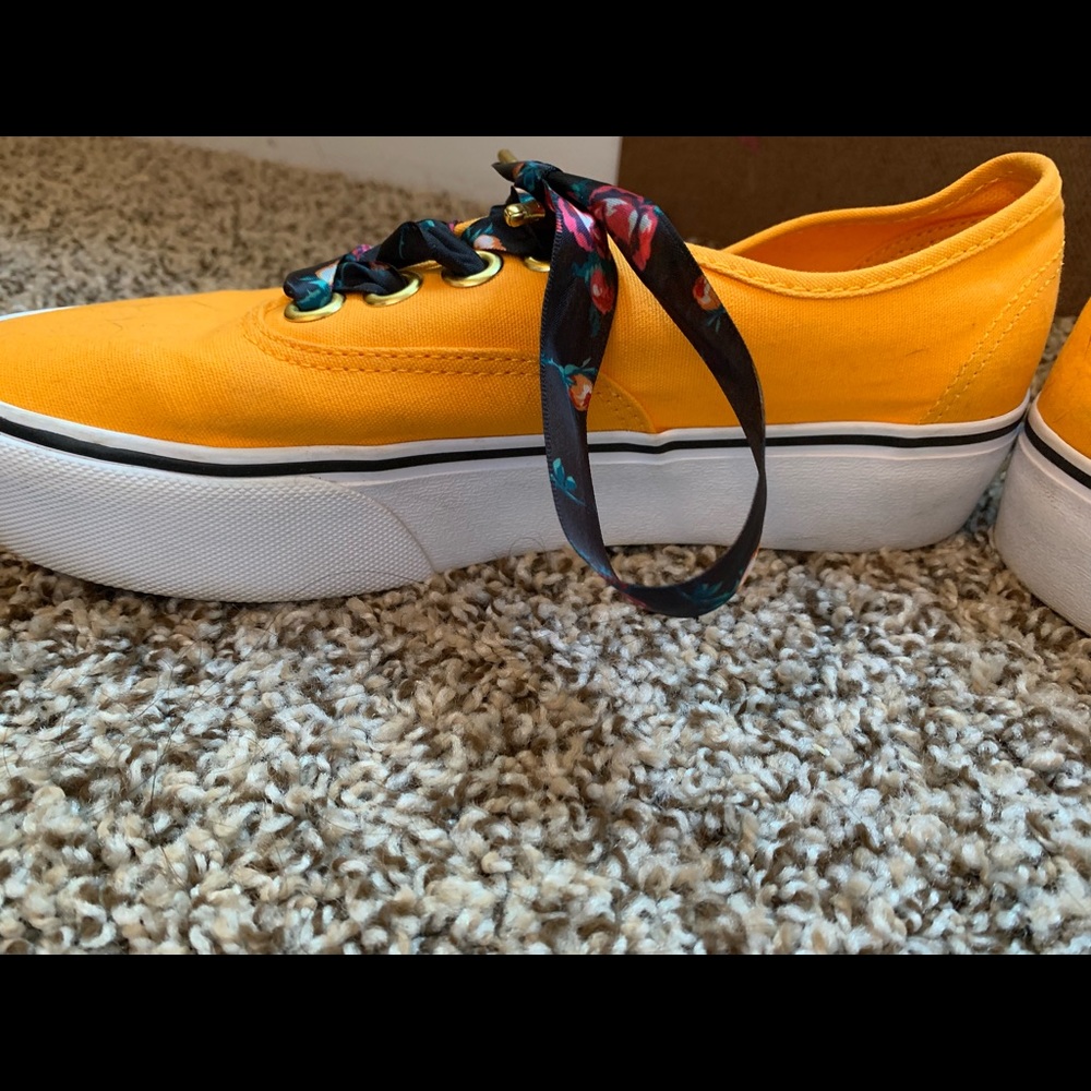 Floral yellow era Vans shoe.